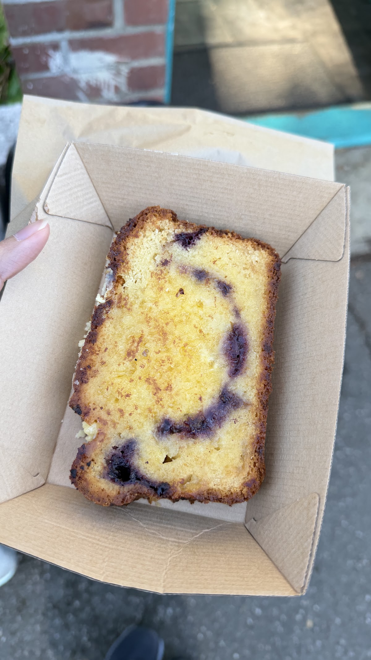 Slice of boysenberry, pear and white chocolate loaf