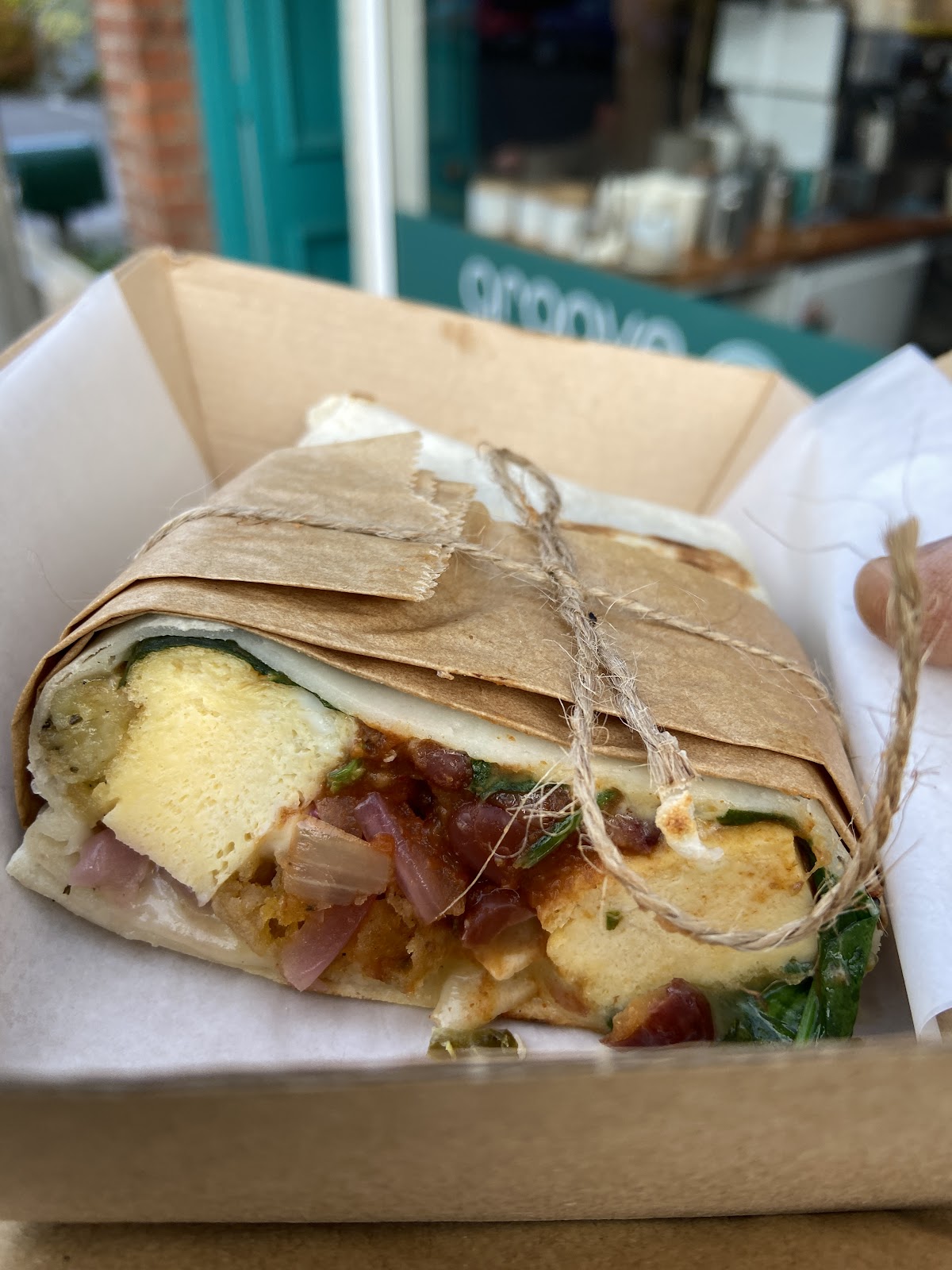 Breakfast burrito in a takeaway box