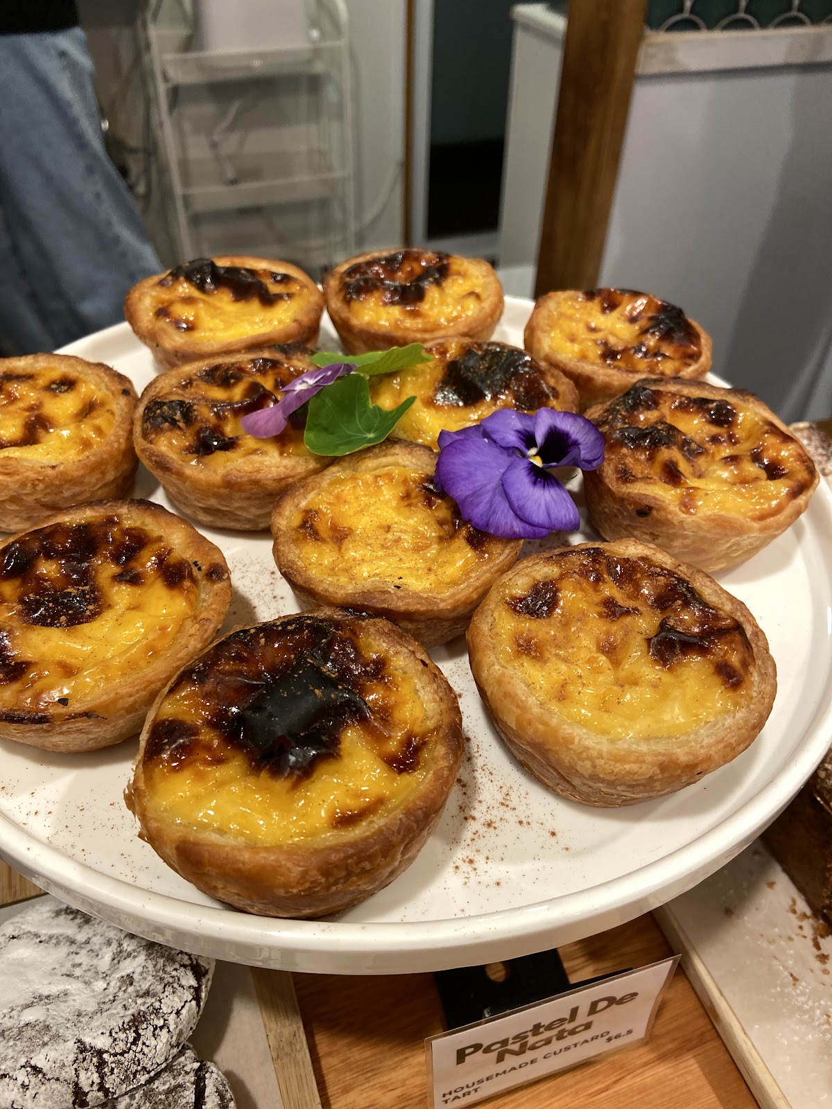 A platter of housemade pastel de nata custard tarts at Groove Espresso